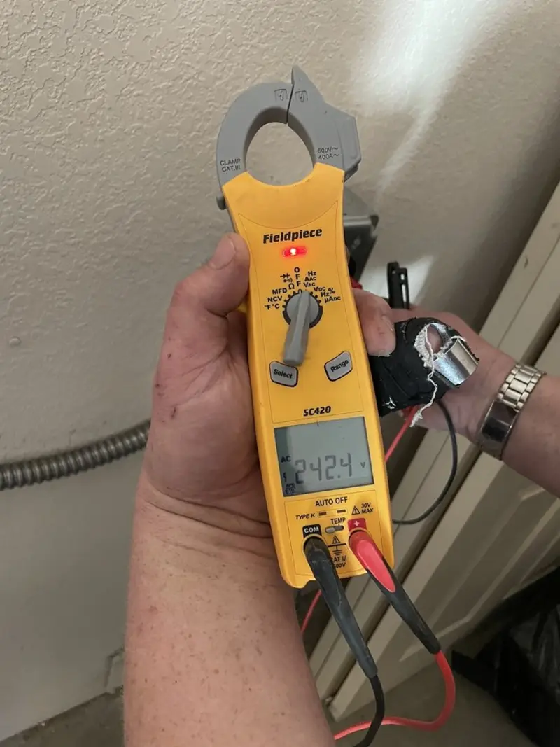 Voltage testing with clamp meter during Outlet Installation in Bret Harte